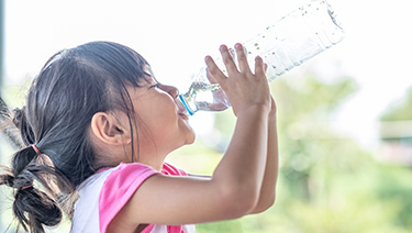 Girl drinking water.